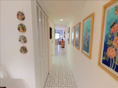 Just Steps to the Sandy Beach from this Two Bedroom Condo